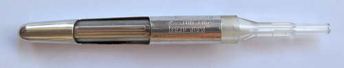ITEM #VP SNOUT: PARKER VP ACRYLIC FILLING UNIT FRONT END. This is a left over original Parker factory part. Parker's idea when designing the filling unit that this is the most critical part of was to keep the front end of your pen and your fingers clean while filling your pen, similar to the idea behind Sheaffer's Snorkel. You were supposed to pull the filling unit out of the pen and fill it by dipping the narrow end of this snout into the ink bottle while pumping the Aerometric type filling unit pressure bar. This didn't work well because the acrylic snout would frequently break during the above operation. If you have a VP that is leaking in front, chances are good that there is a very tiny crack in this part. This wasn't intended to be a user changed part, but if you're careful, you can get the old unit apart, put a sac on this snout, re-assemble the filling unit, and be good to go. If you remind me, I'll include a new tapered PVC sac. 